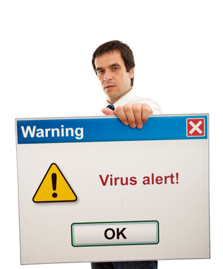 IT Support small business man with computer virus alert